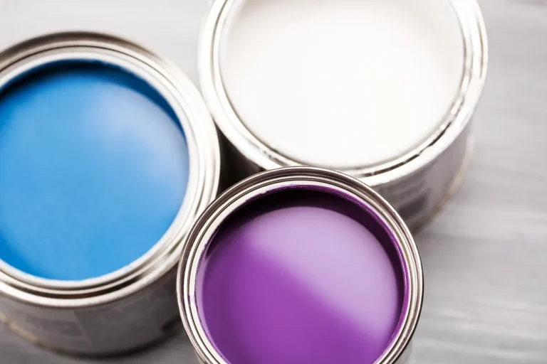 a picture of white paint, blue paint and purple paint