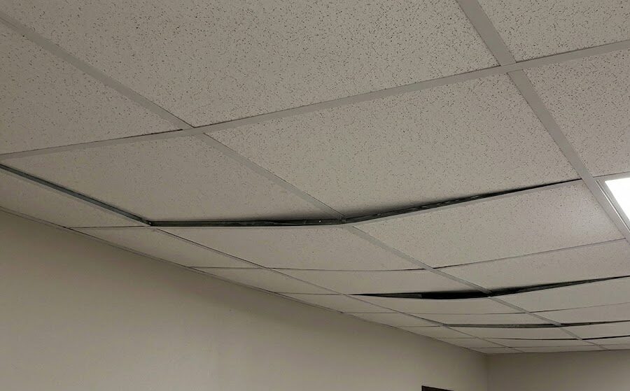 sagging tiles or grid section