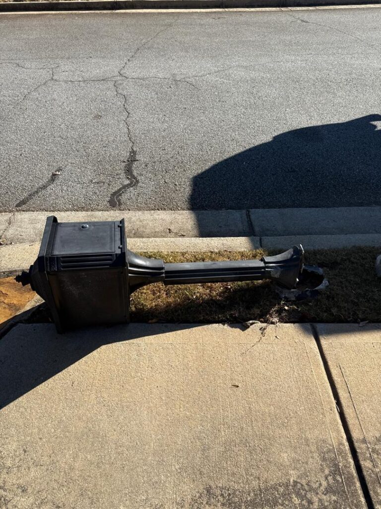 broken metal mailbox