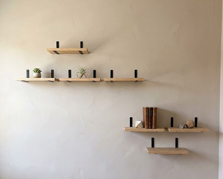 items on a floating wooden shelf